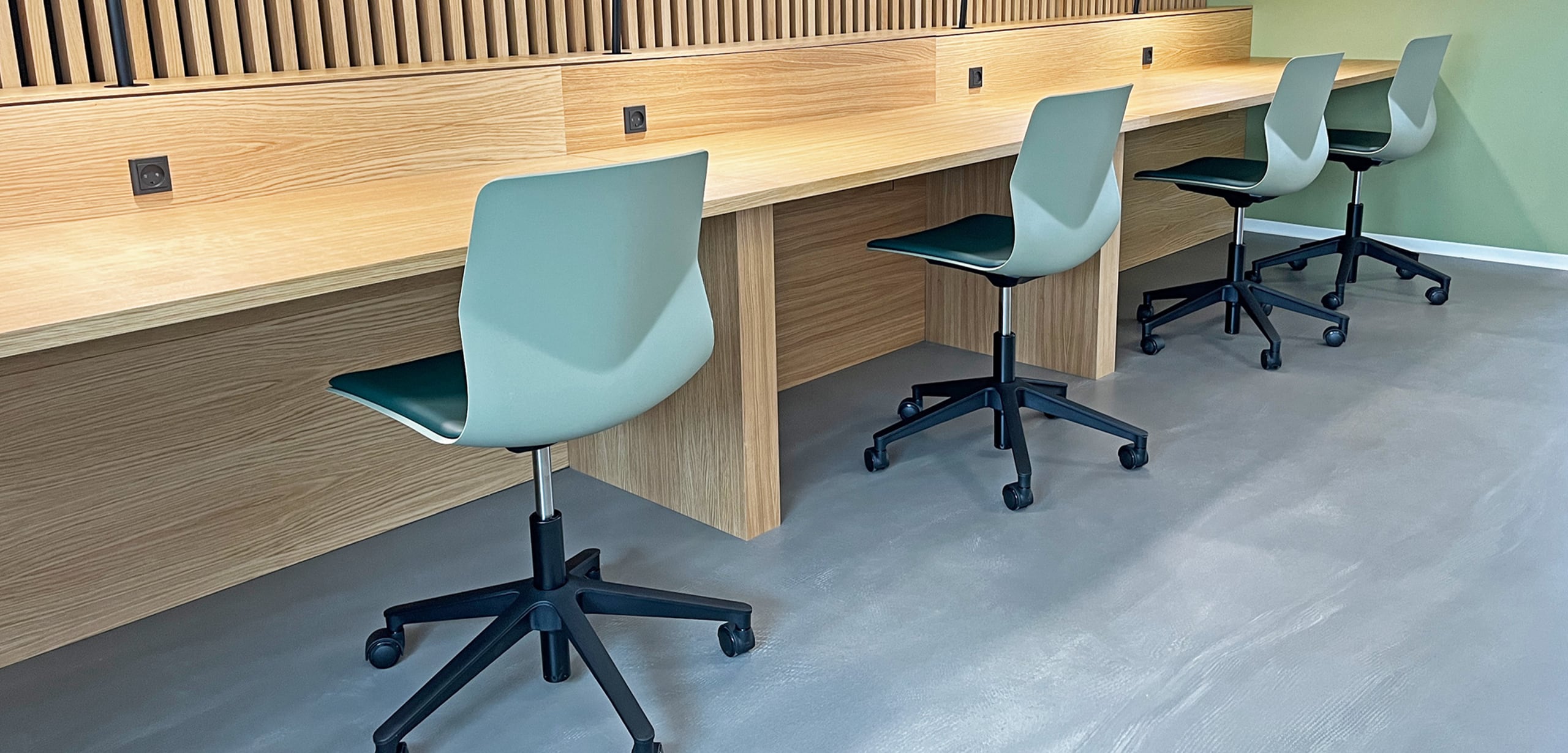 Study booths, desk workstations and chairs in a study hall